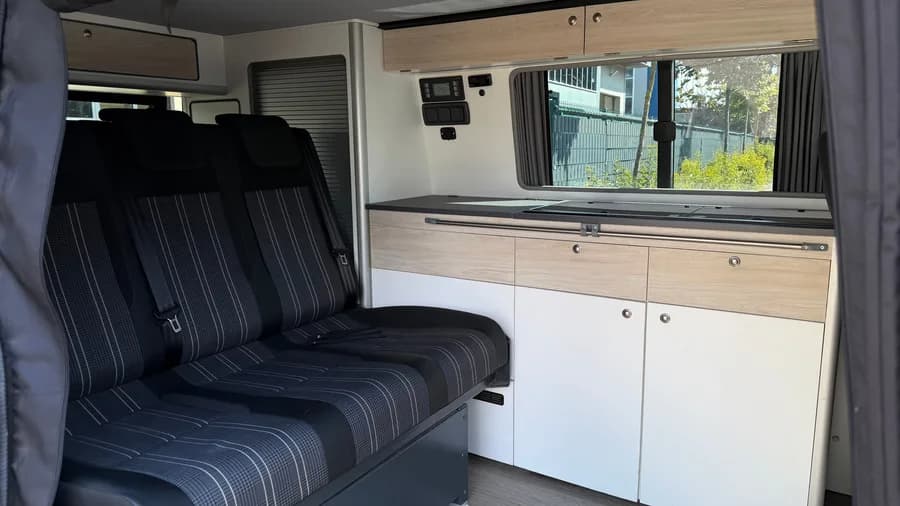 Interior with the STIDE rail seat system, kitchen worktop and electrical control panel