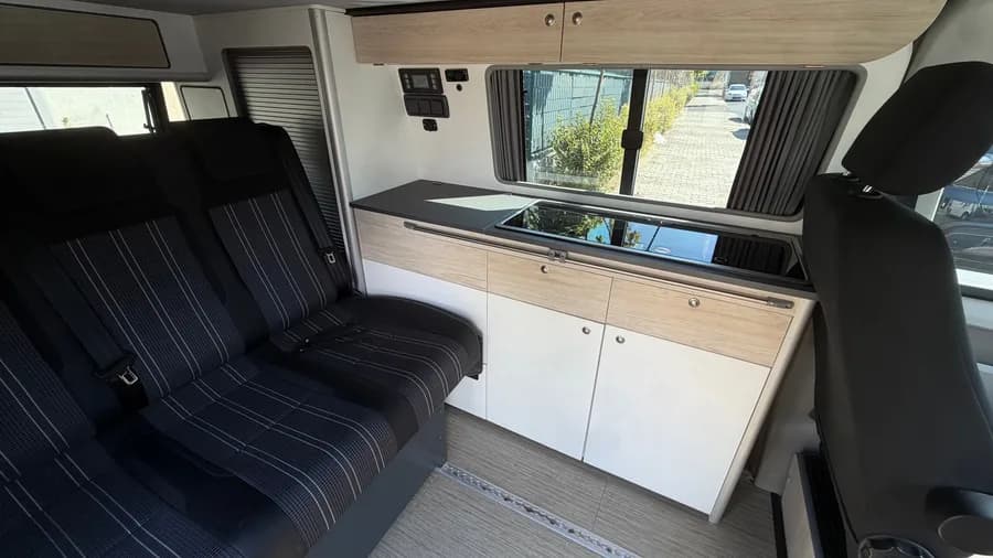 Wider interior view of the seat system and the kitchen unit