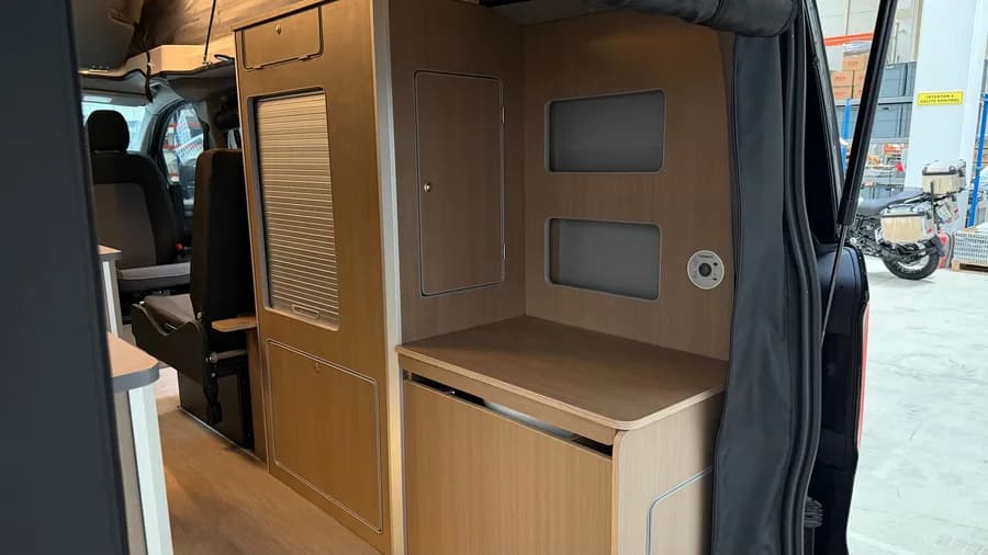 Washroom module with the roller-shutter cabinet and the cassette toilet closed
