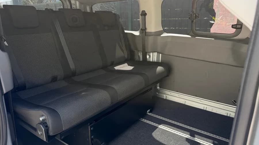 Interior with the STIDE three-seat rail bench in the seating position