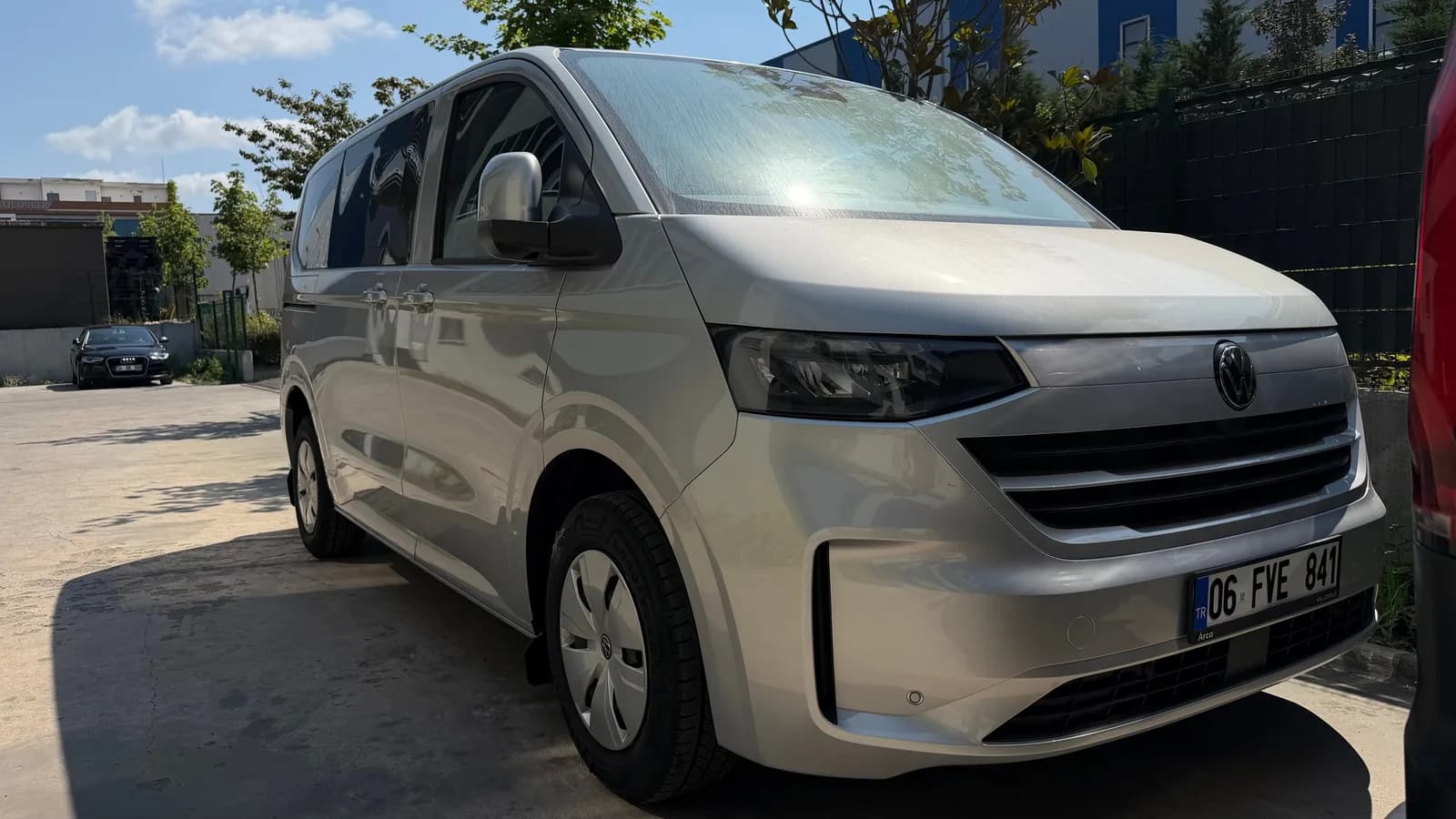 Grey Volkswagen Transporter Weekender, front three-quarter view