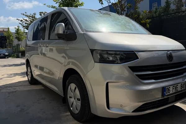 Grey Volkswagen Transporter Weekender, front three-quarter view