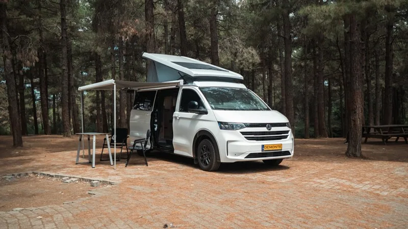 Efes parked on a paved area with its awning out and doors open